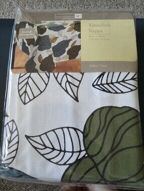 Select Edition "Leaves" rectangle tablecloth measuring 60 inches by 84 inches.